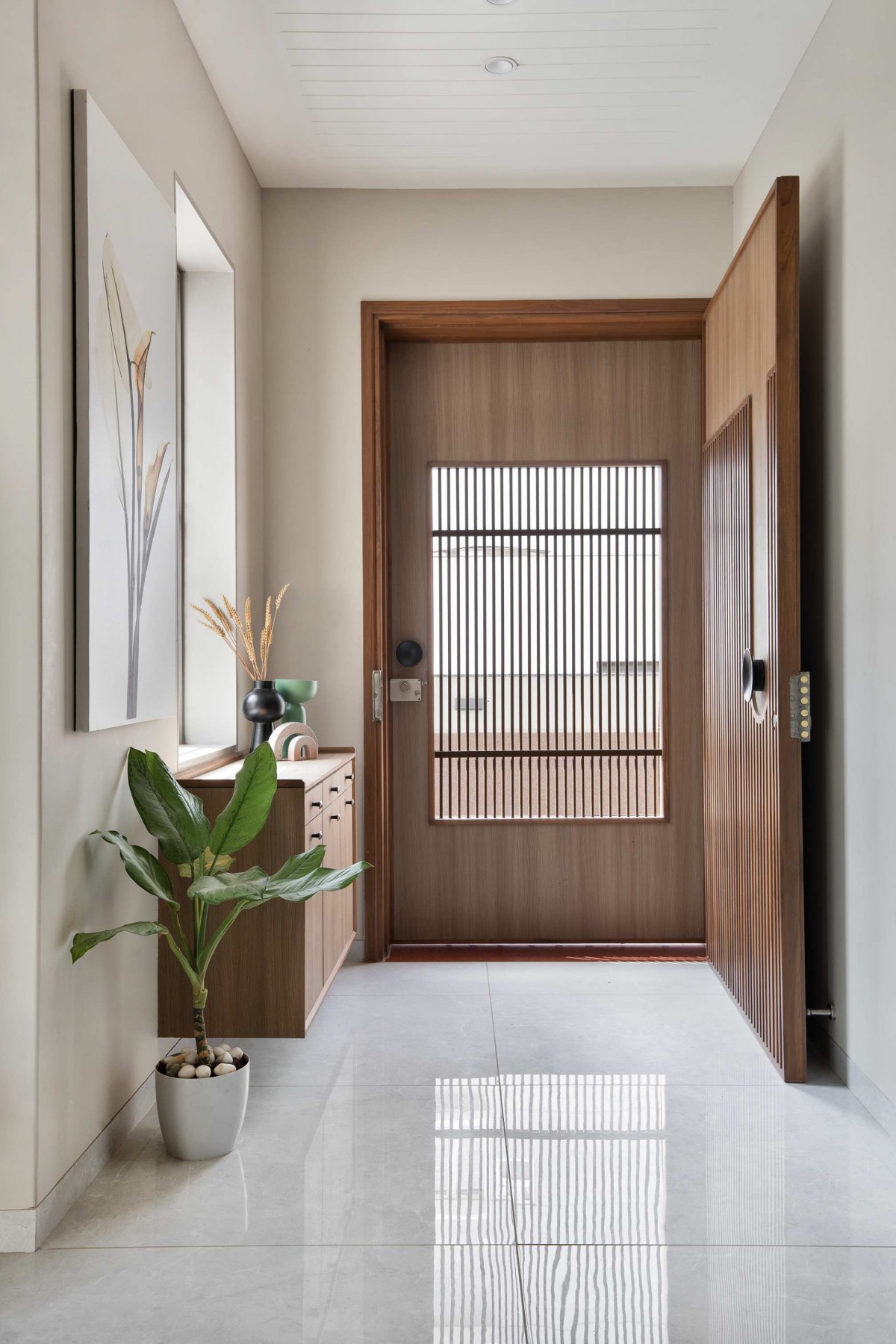 Entrance foyer of A Modern Residence with a Natural Touch by V Shah Design Studio