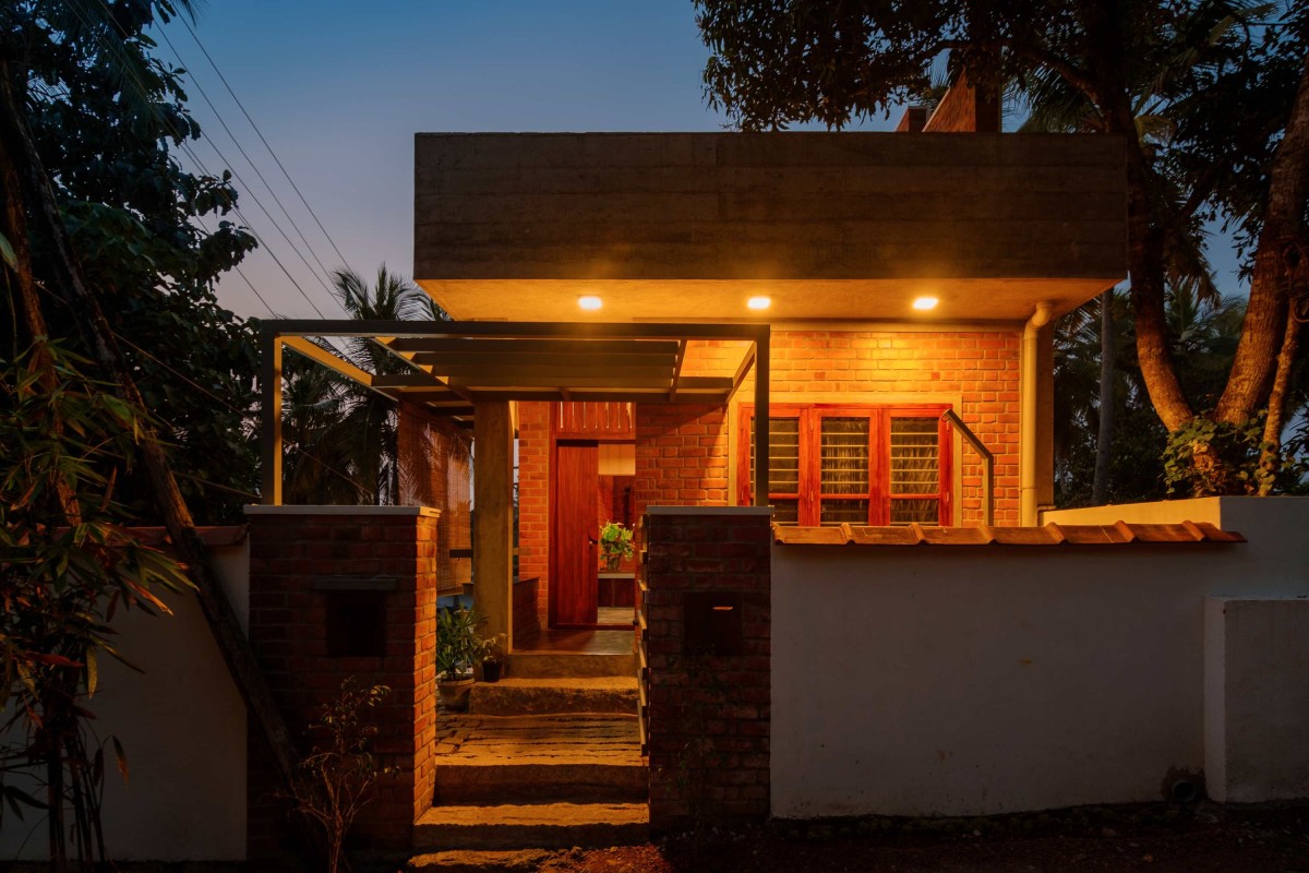 Dusk light exterior view of Idam- A house that calls back by Ishtika Design Studio