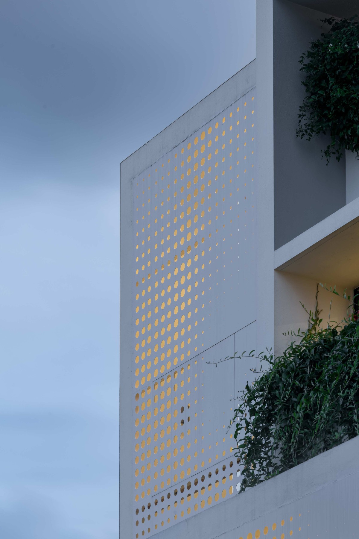 Facade view in dusk light of Lucid House by ma+rs