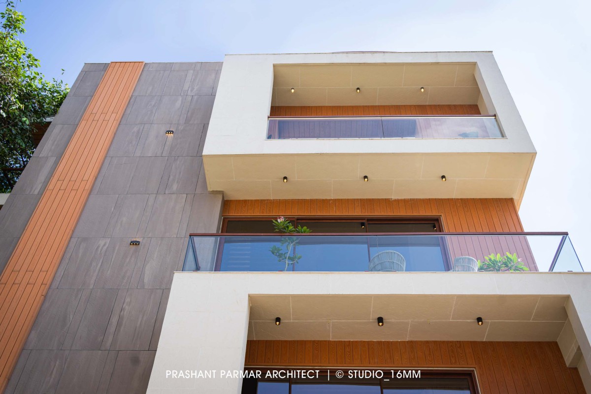 Exterior view of Elevated Compact House by Prashant Parmar Architect  Shayona Consultant