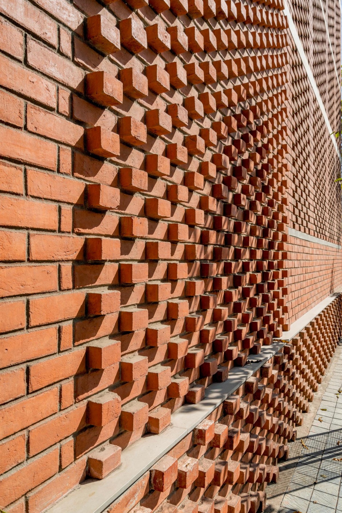 Detailed shot of brick wall of An Urban House by MISA Architects