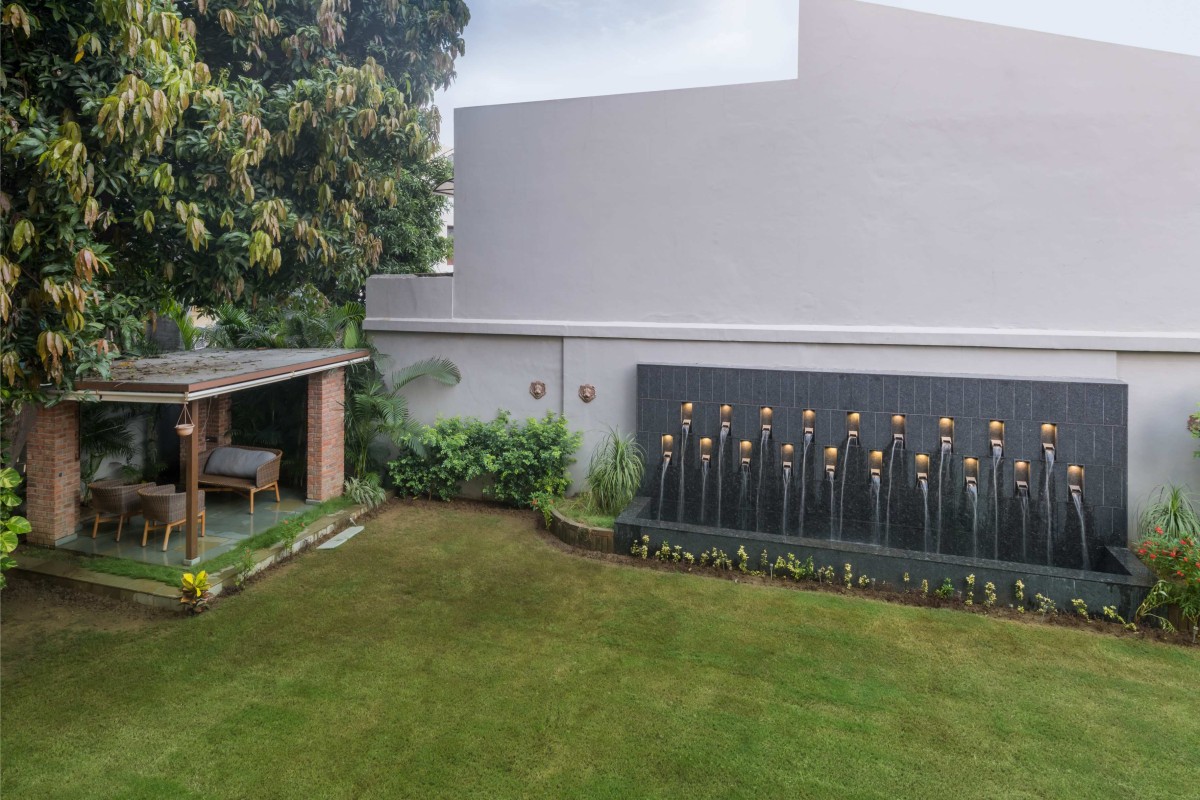 Lawn and Outdoor seating area of An Indian Abode by K.N. Associates