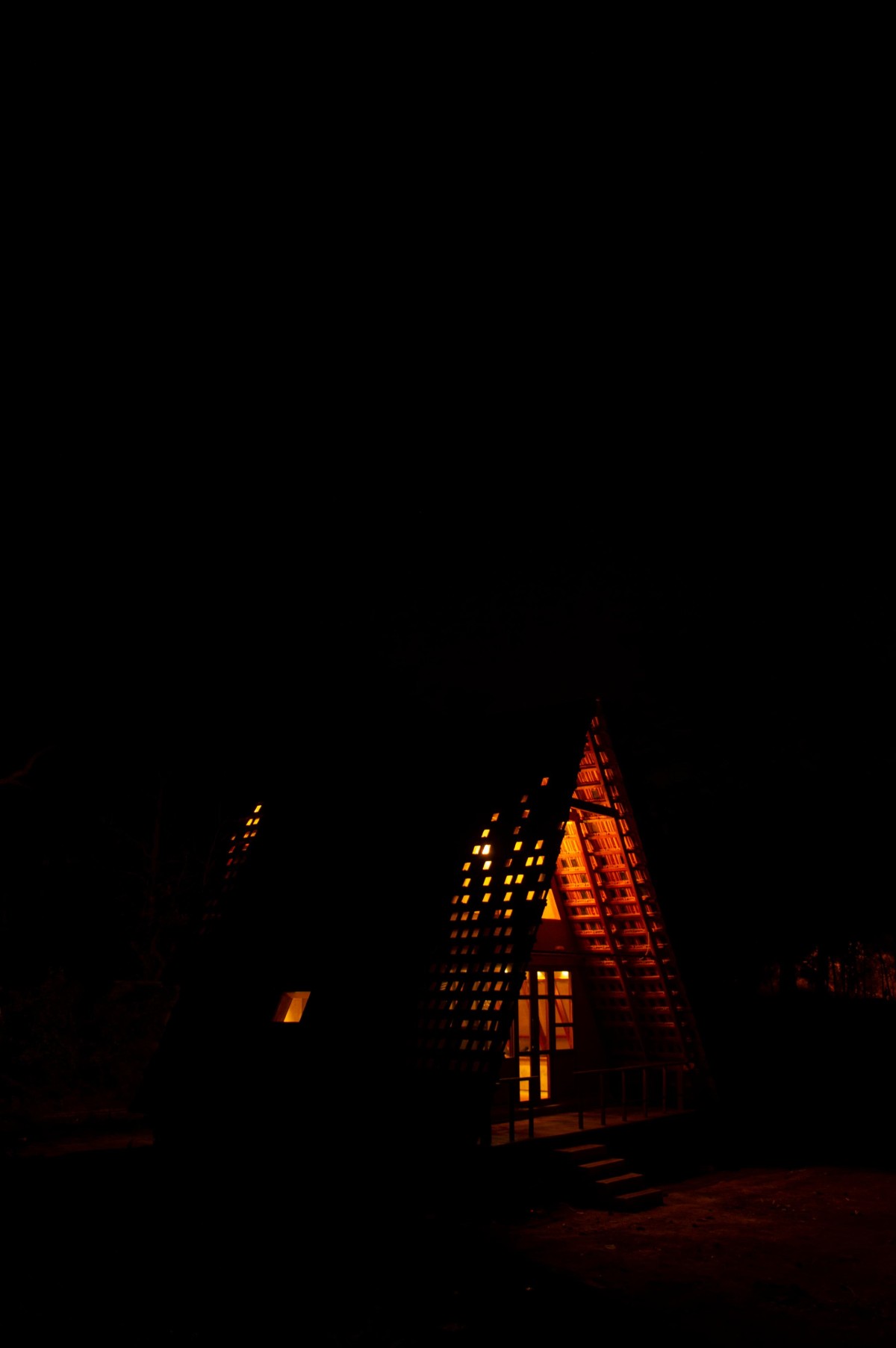 Night shot of exterior view of Solitude by Out Of The Box 0
