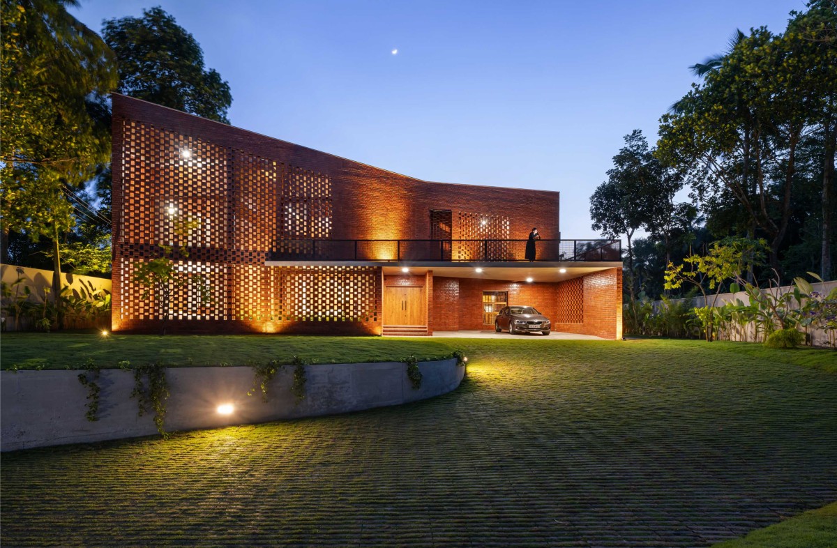 Dusk light exterior view of The Kenz House by Srijit Srinivas Architects
