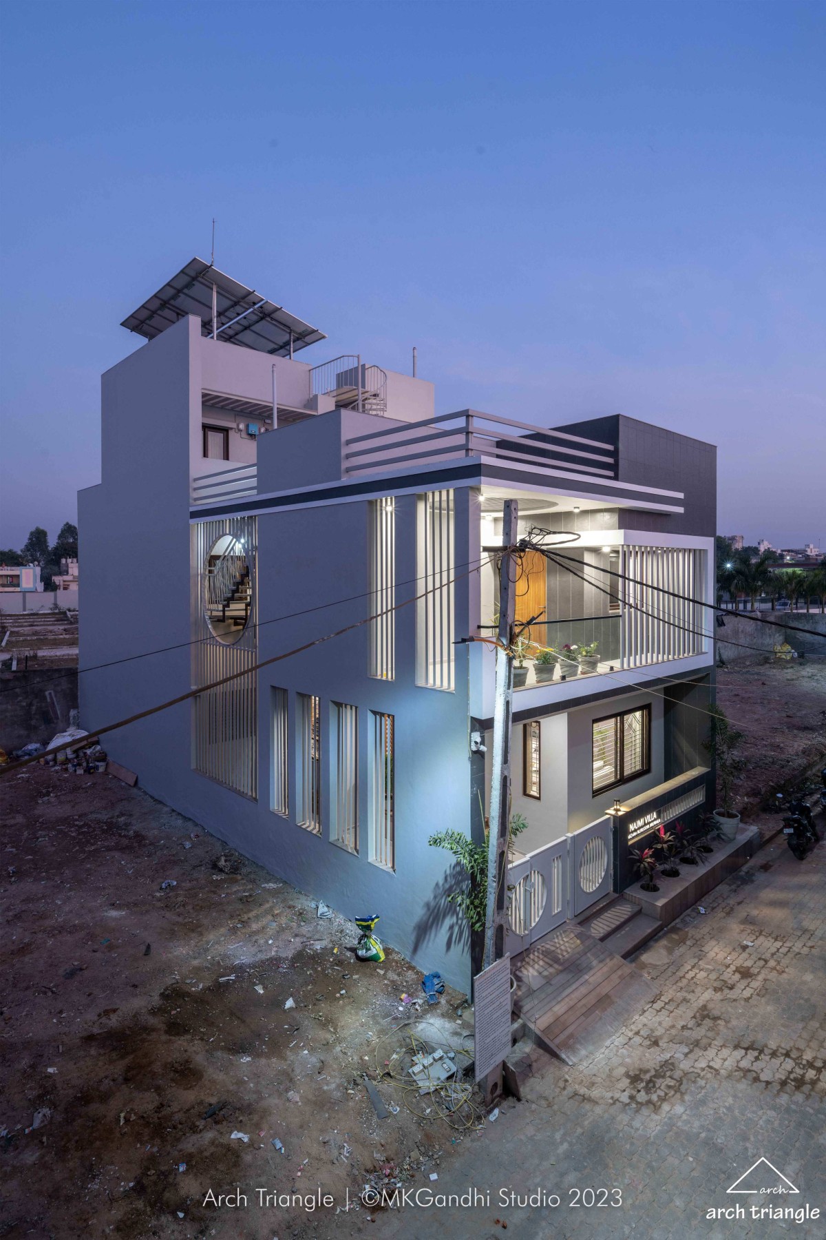 Dusk light exterior view of Jiruwala Residence by Arch Triangle