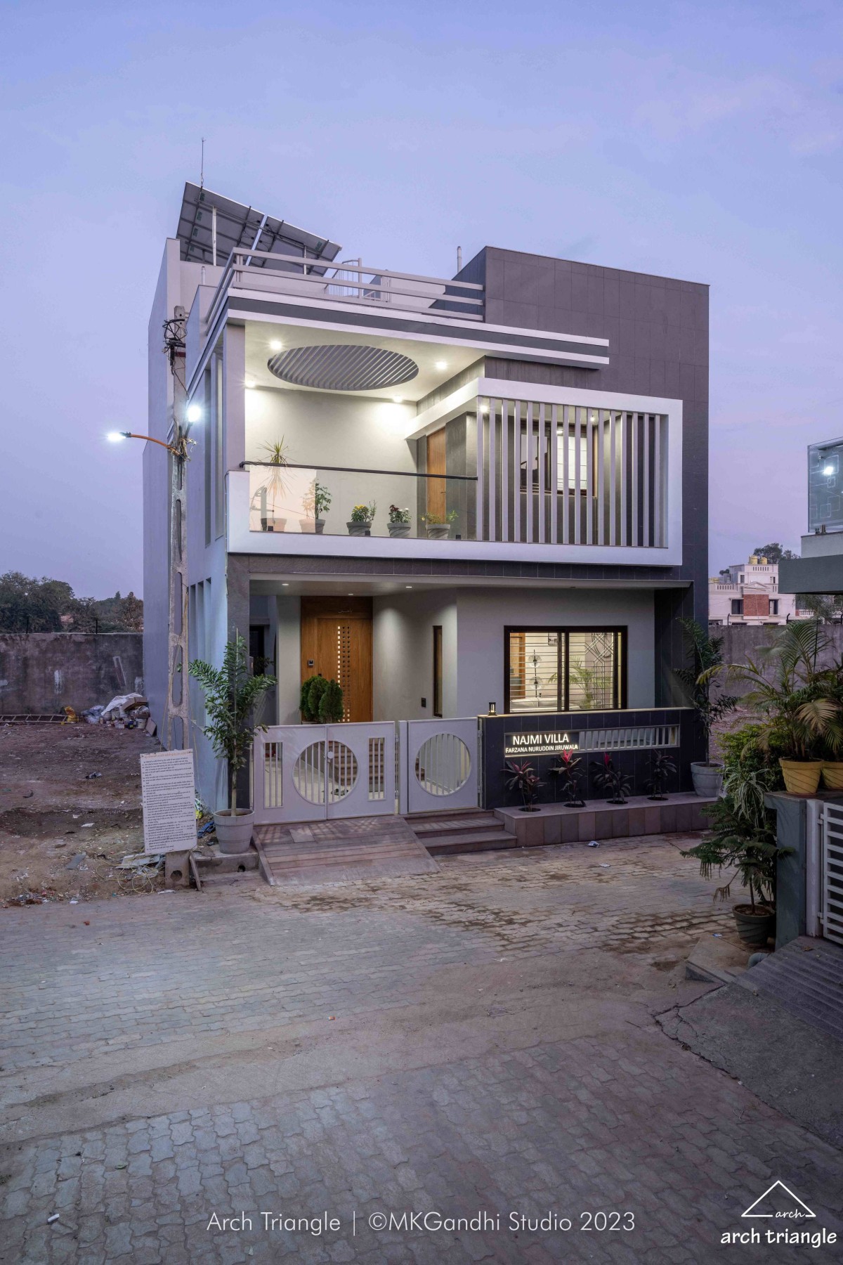 Dusk light exterior view of Jiruwala Residence by Arch Triangle