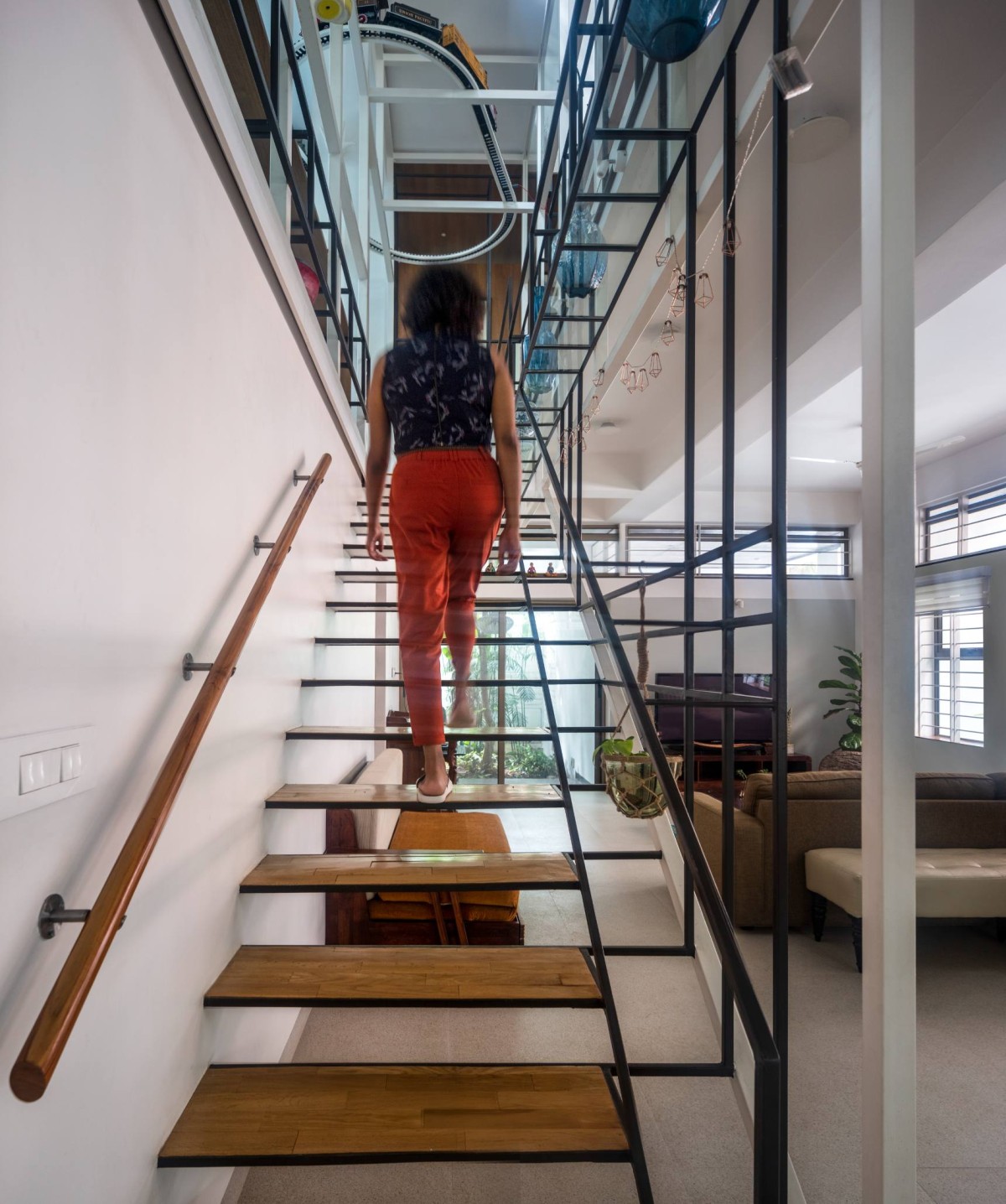 Climbing up the stairs to the Mezzanine of Aadyam by Gaurav Roy Choudhury Architects