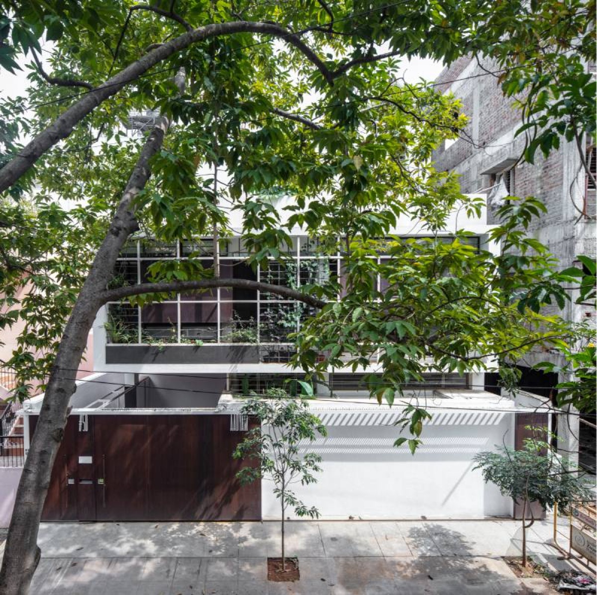 Elevated Street View of the Front of Aadyam by Gaurav Roy Choudhury Architects