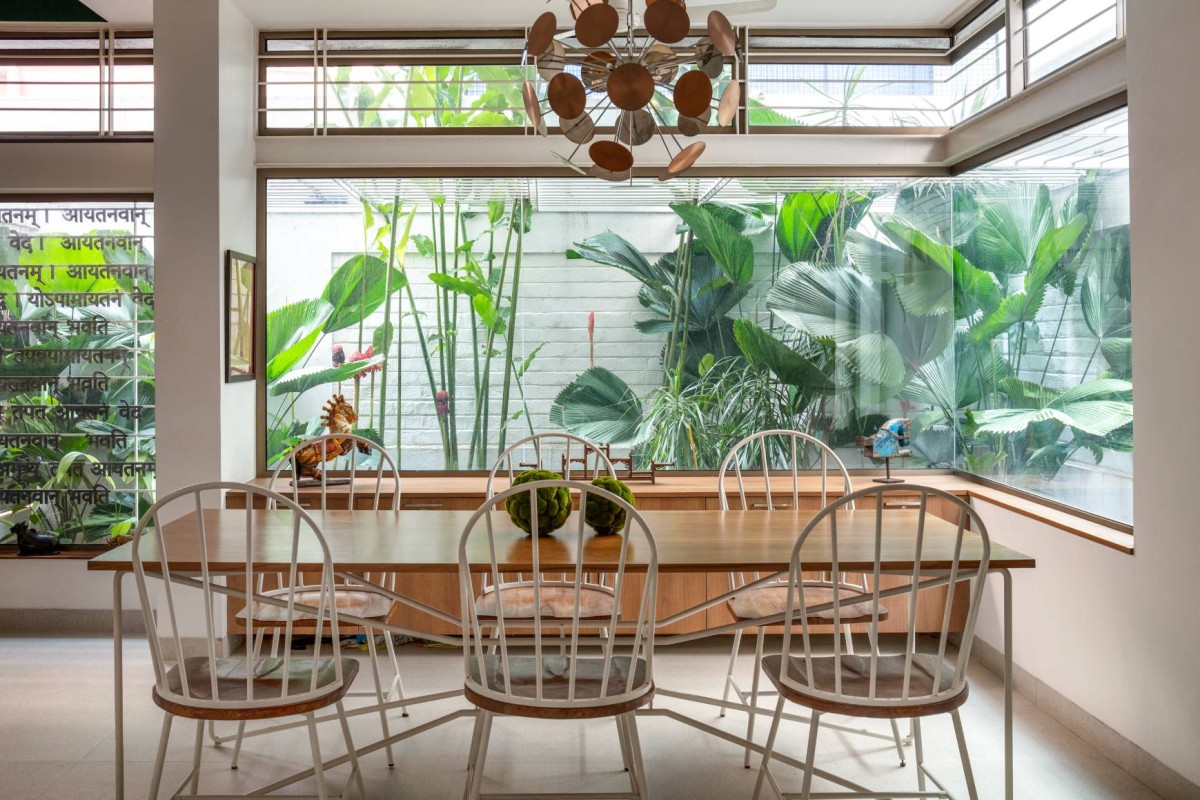 The Dining Area with the Side Garden of Aadyam by Gaurav Roy Choudhury Architects