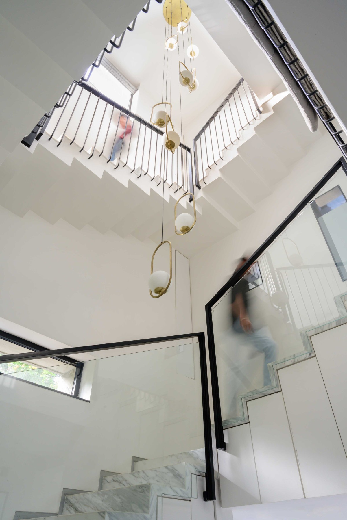Staircase and Chandelier of The Grid Box by Unit93