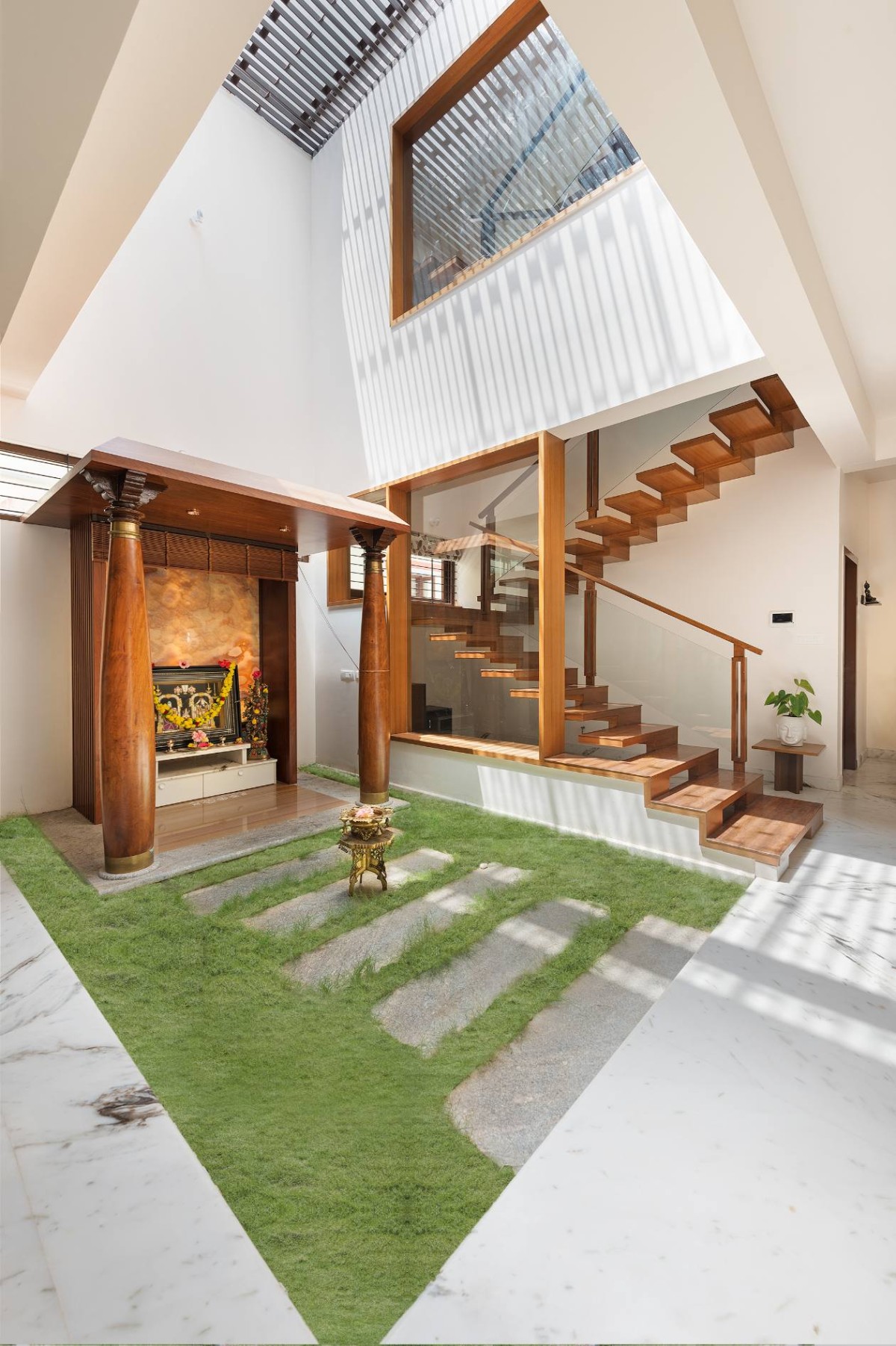 Puja room courtyard of Twin Courtyard House by ID+AS Architects