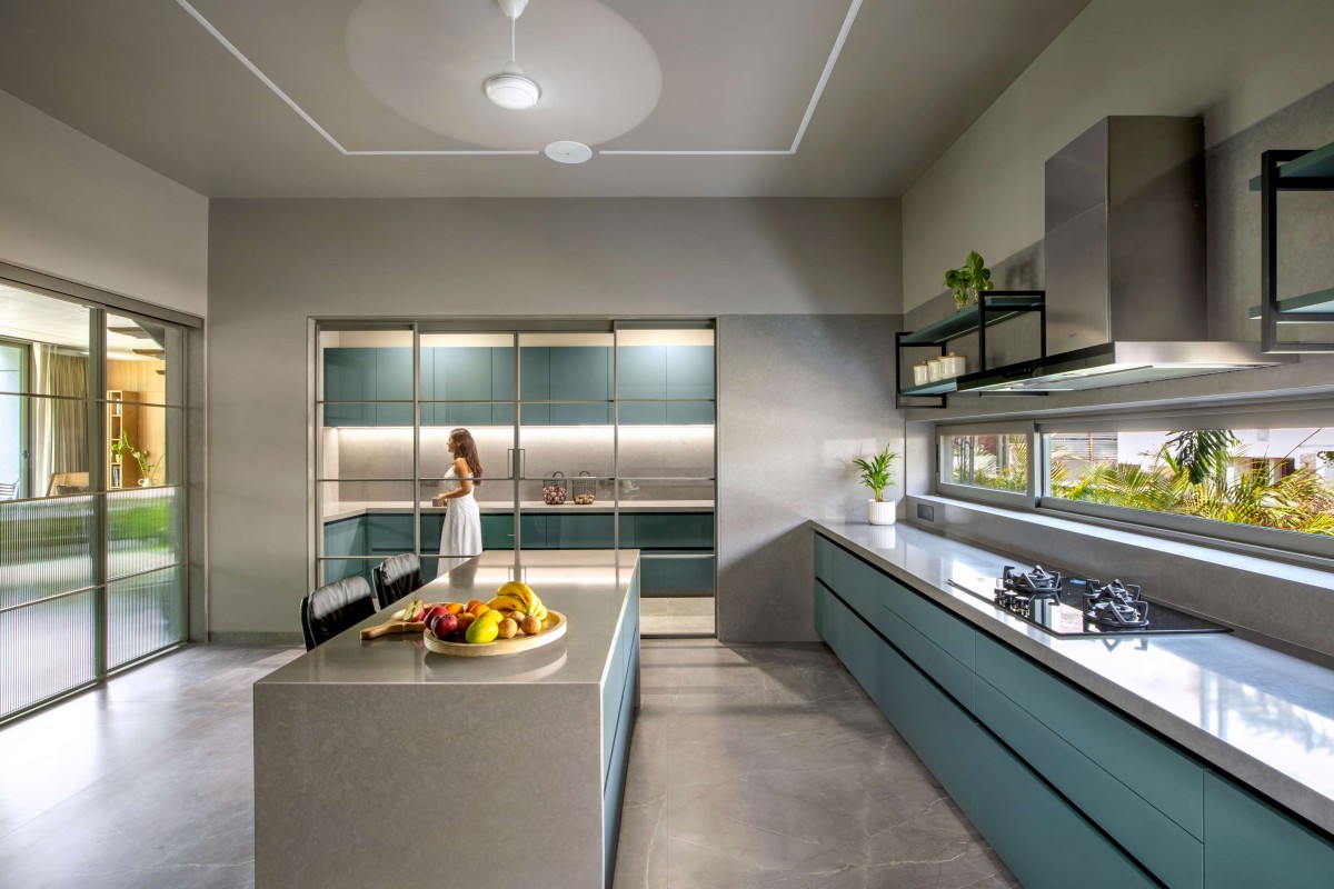 Kitchen of 16 Screens House by A+T Associates