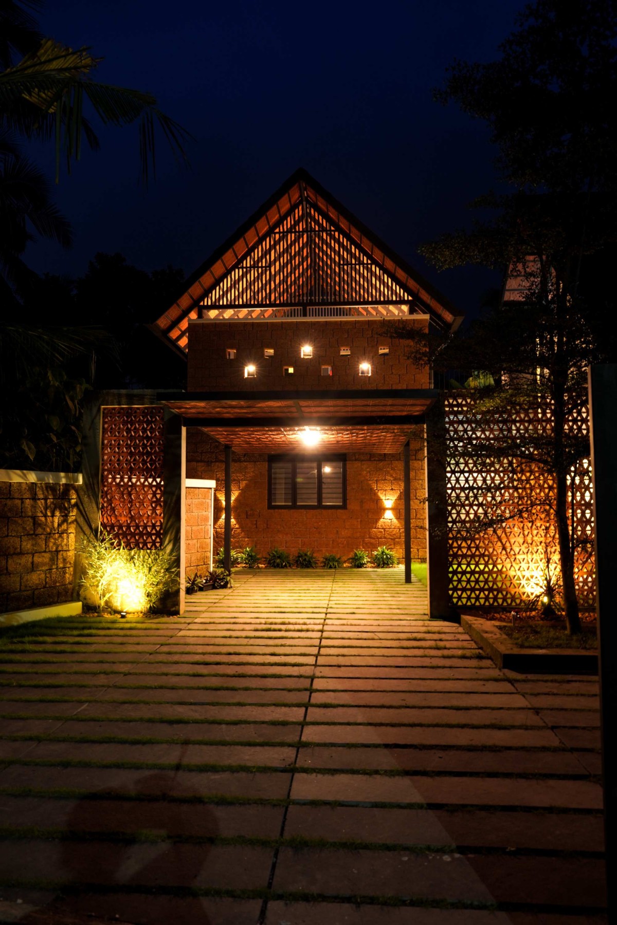 Night shot of exterior view of Canopy Home by Scribble Engine