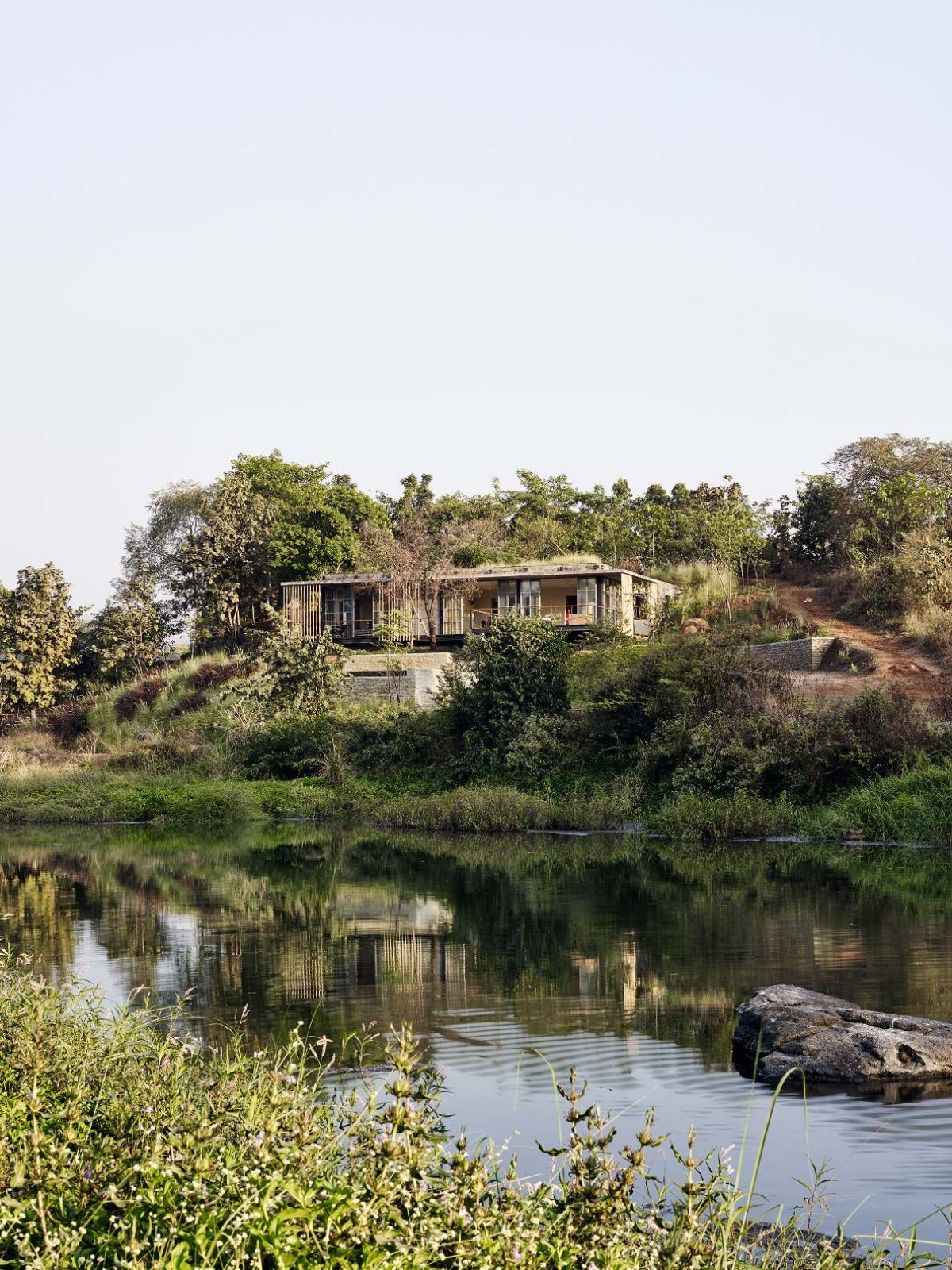 Landscape view of The Riparian House by Architecture BRIO