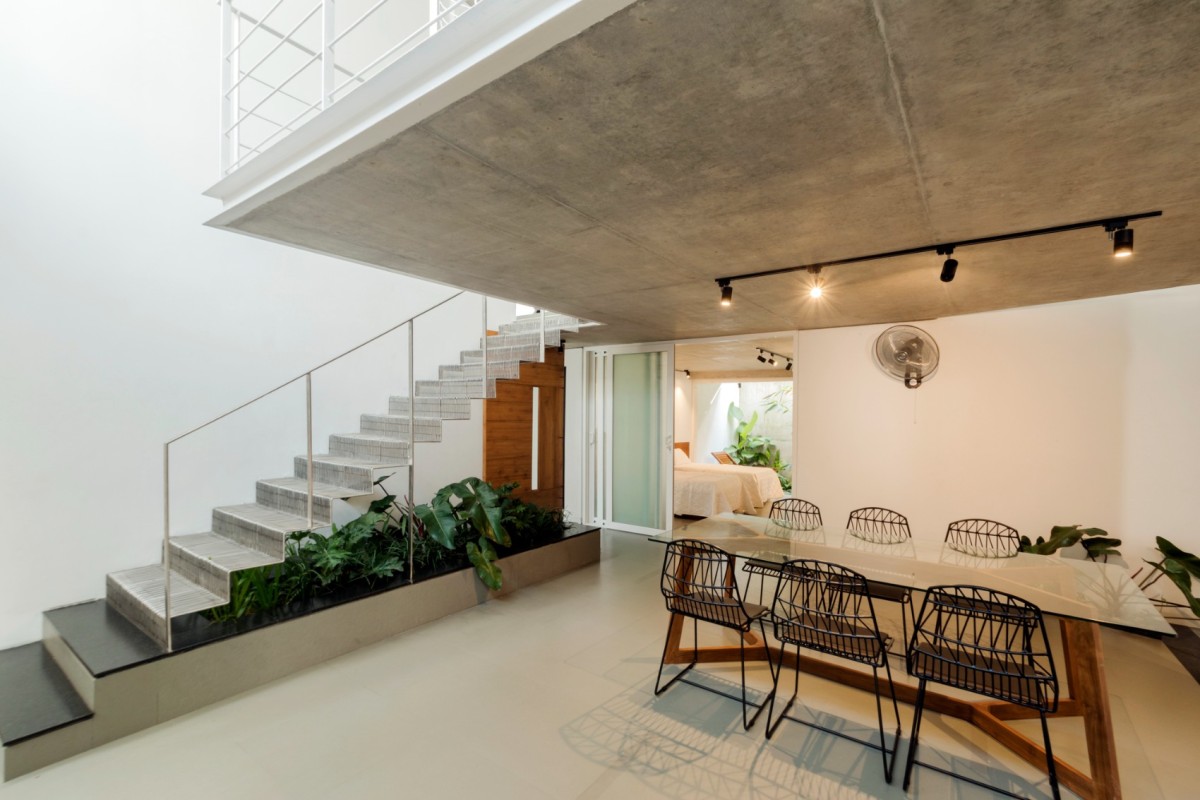 Dining and Staircase of Buoyant Hue by Mindspark Architects