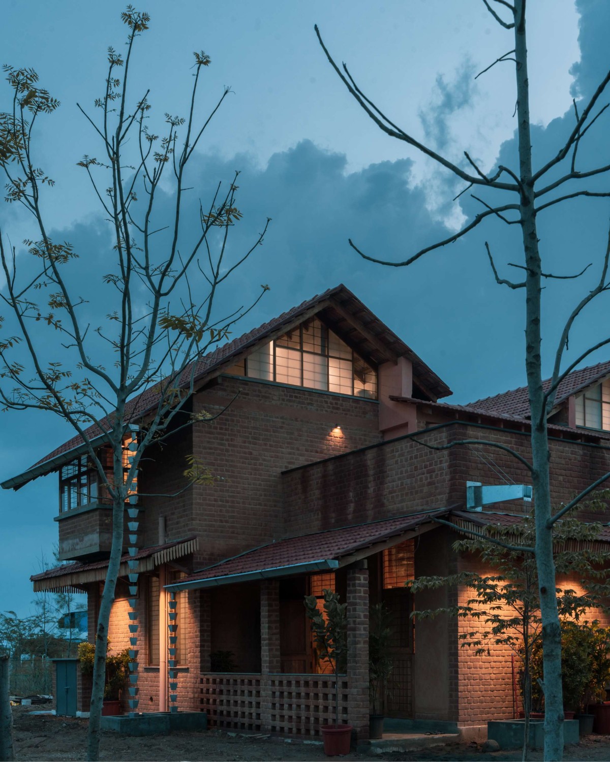 Dusk light exterior view of Brick Manor by Bhutha Earthen Architecture Studio