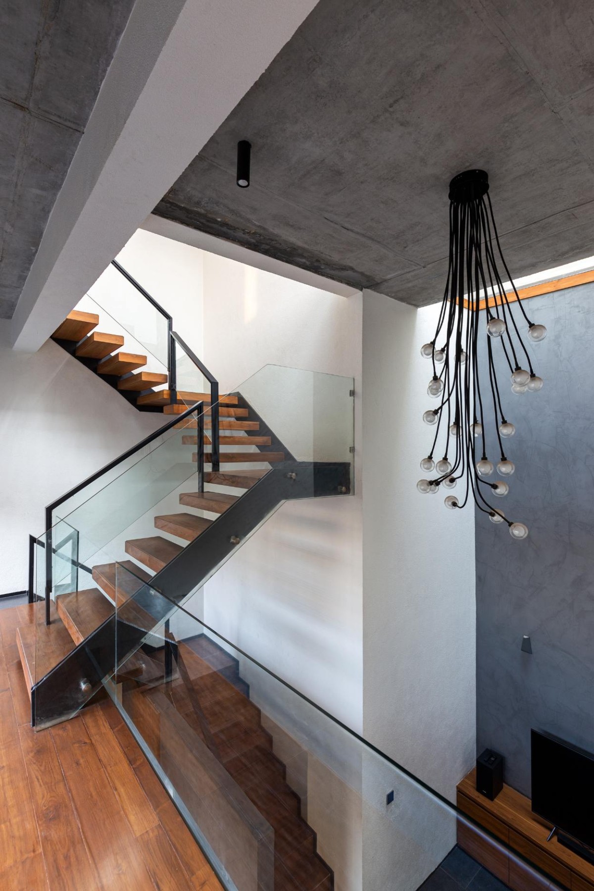 Staircase and Chandelier of House Within by Arch.Lab
