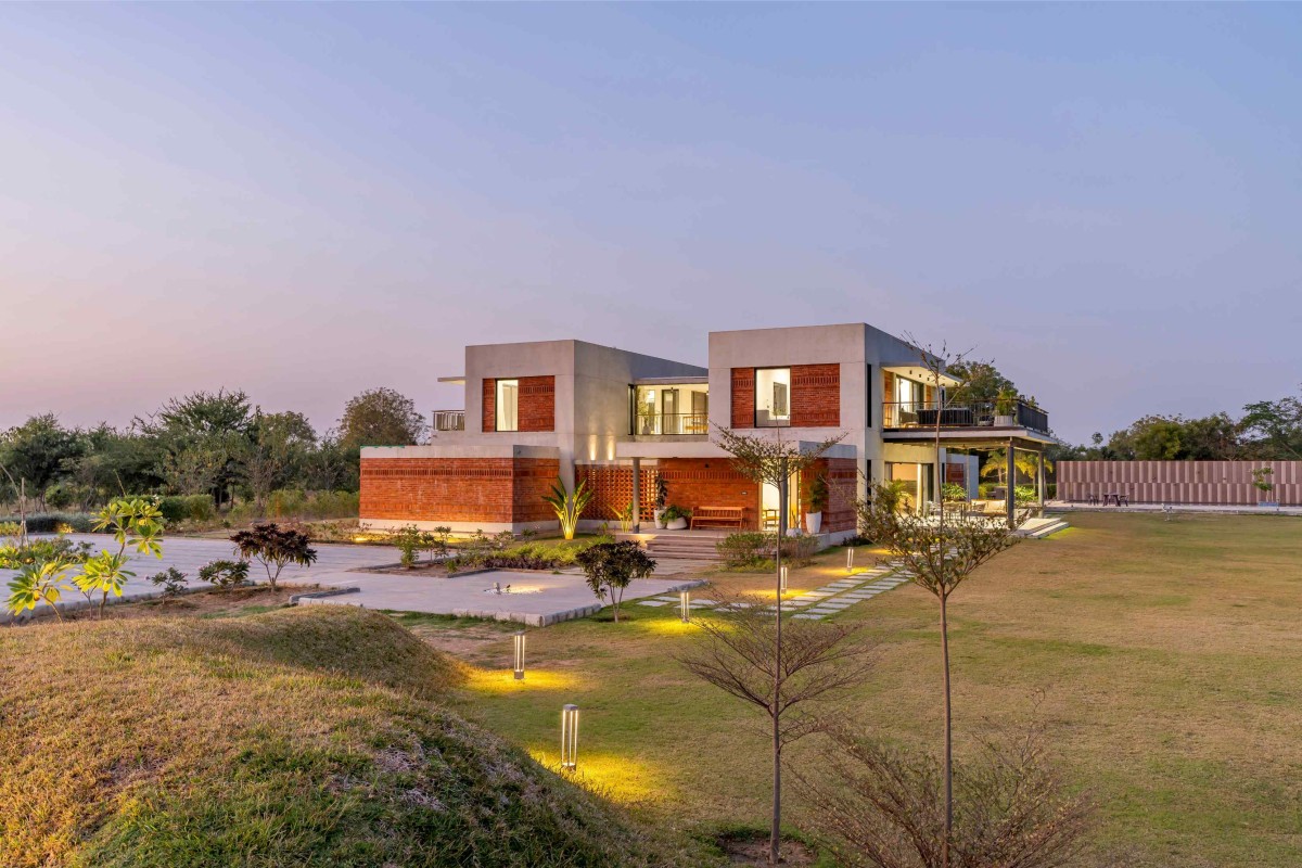 Dusk light exterior view of Agrawal Farm by Urbscapes