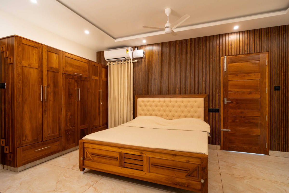 Bedroom of Anandha Padhmam by Blue Hammer Developers
