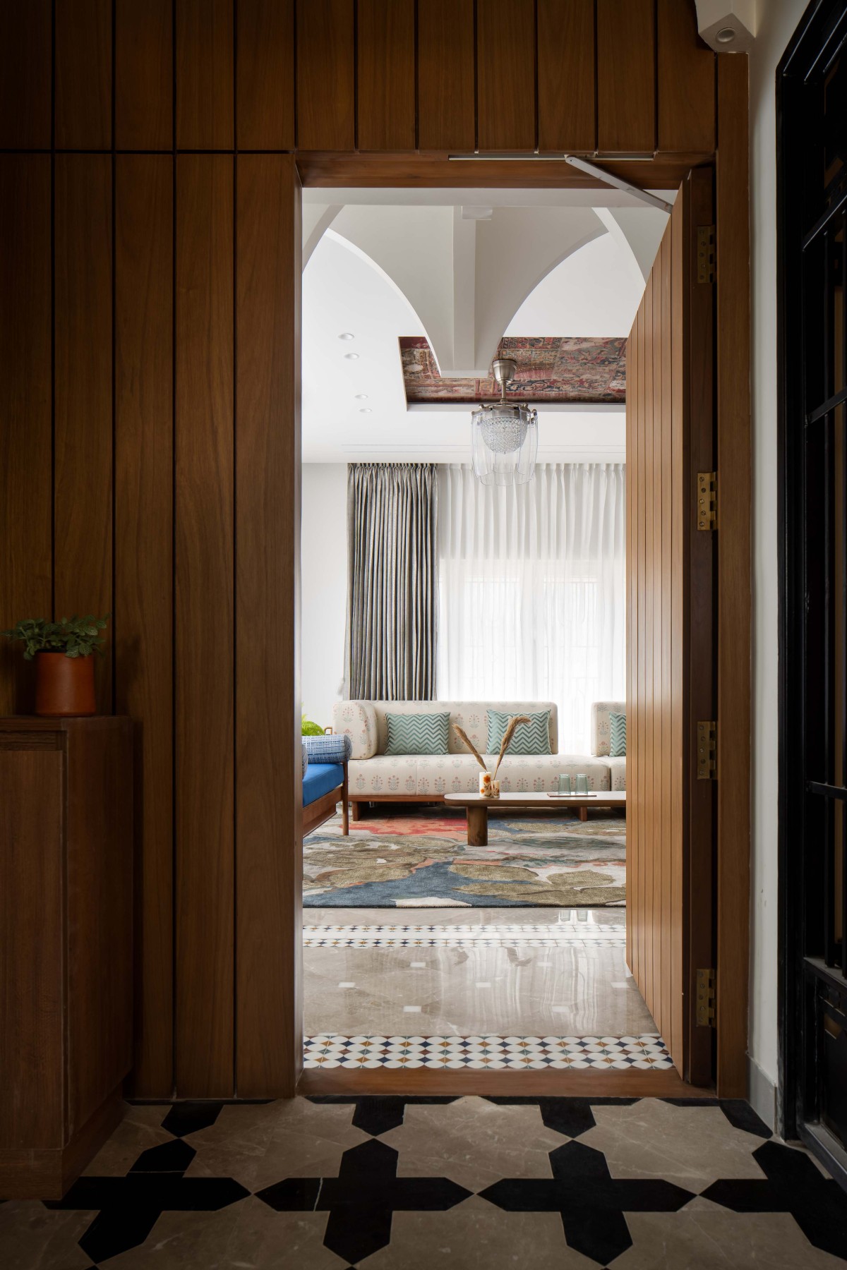 Secondary entrance towards the Living room of Mehraab by &t studio