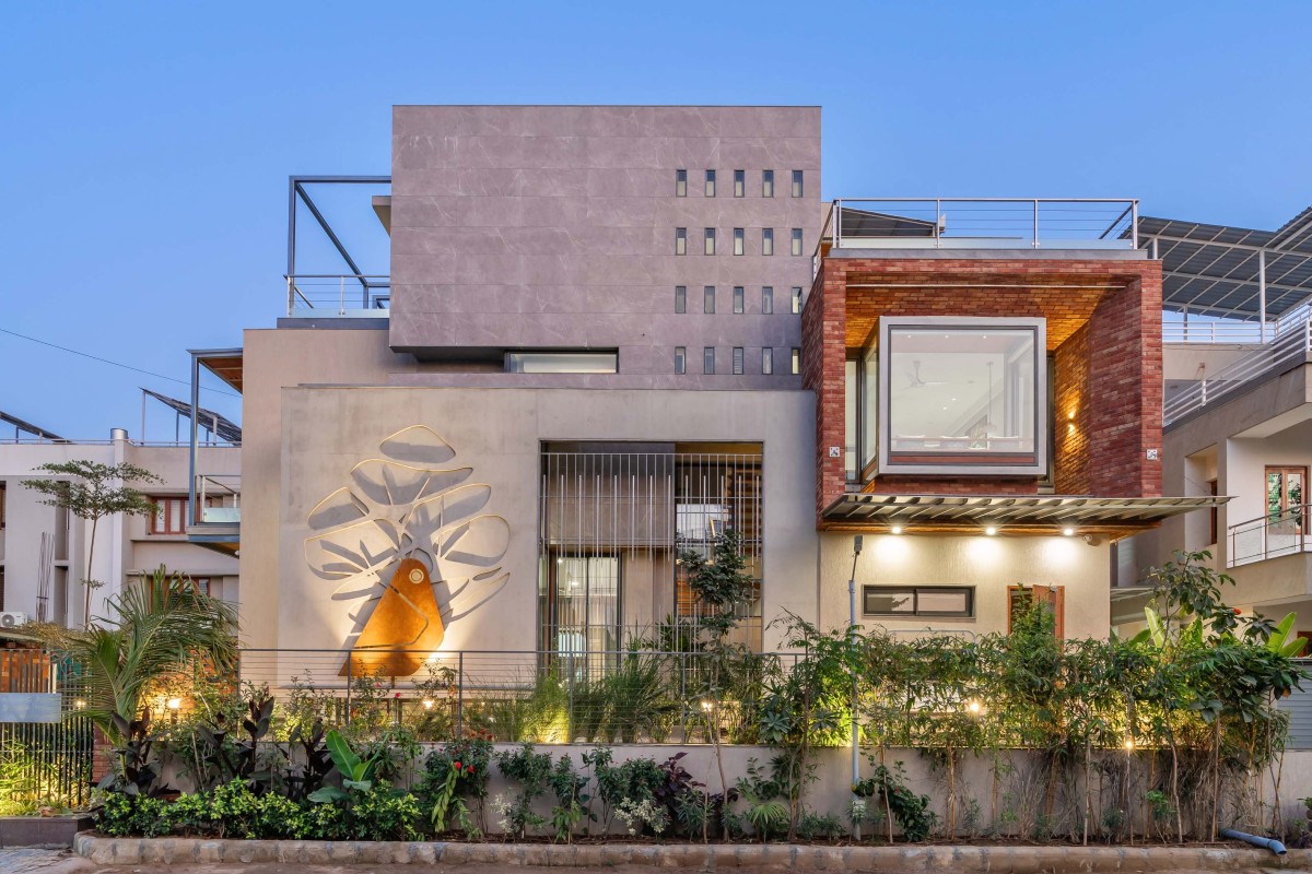 Dusk light exterior view of The Concrete Tree House by Architects at Work