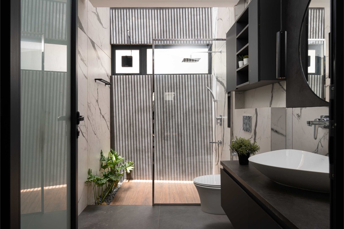 Bathroom of Open Sky Residence by Muaz Rahman Architects