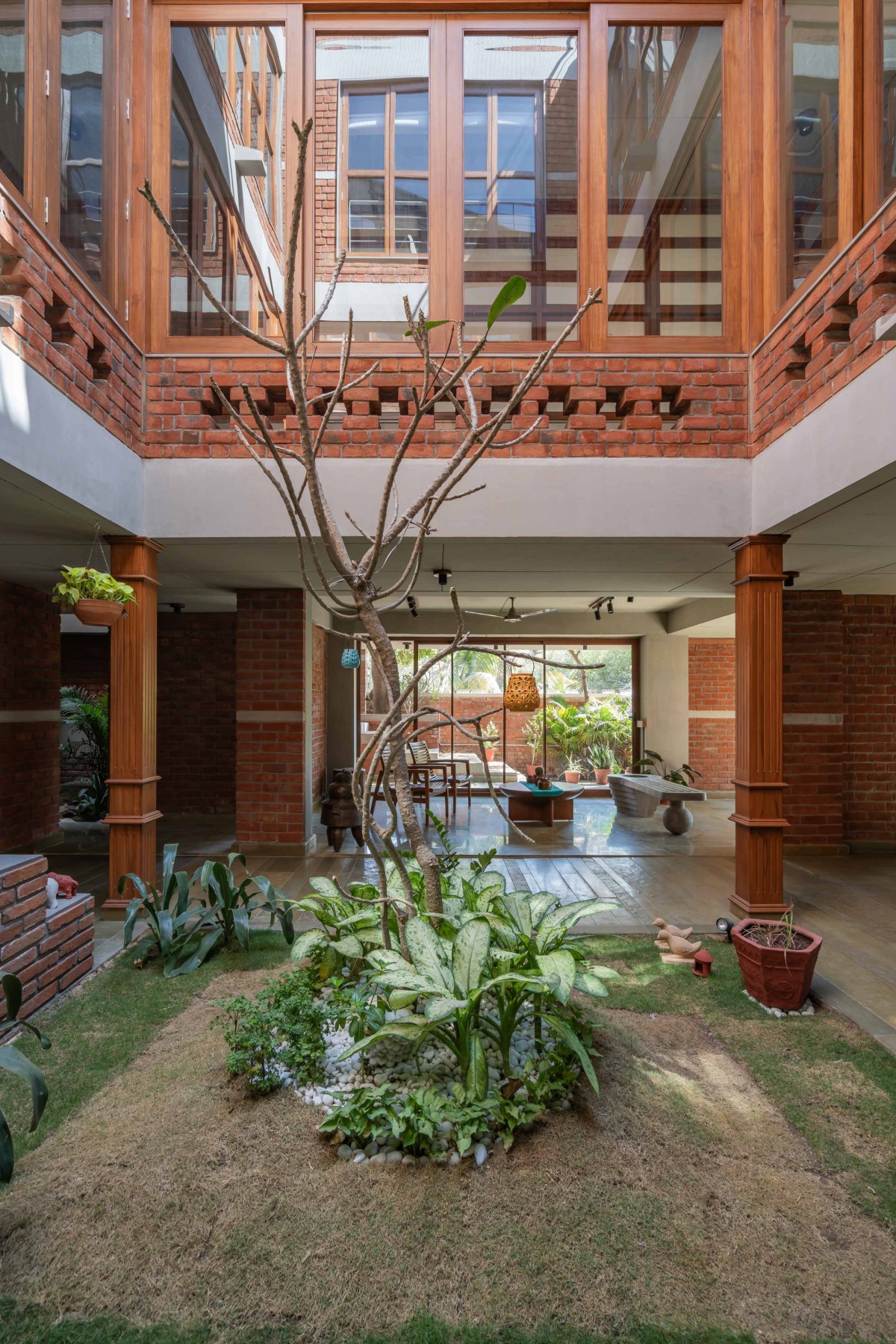 Open-to-sky courtyard of The Maze House by MISA Architects