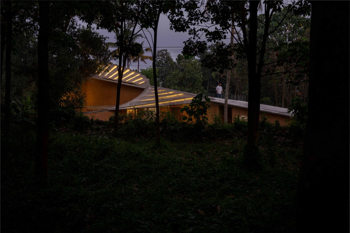 Dusk light exterior view of Jack Fruit Garden Residence by Wallmakers