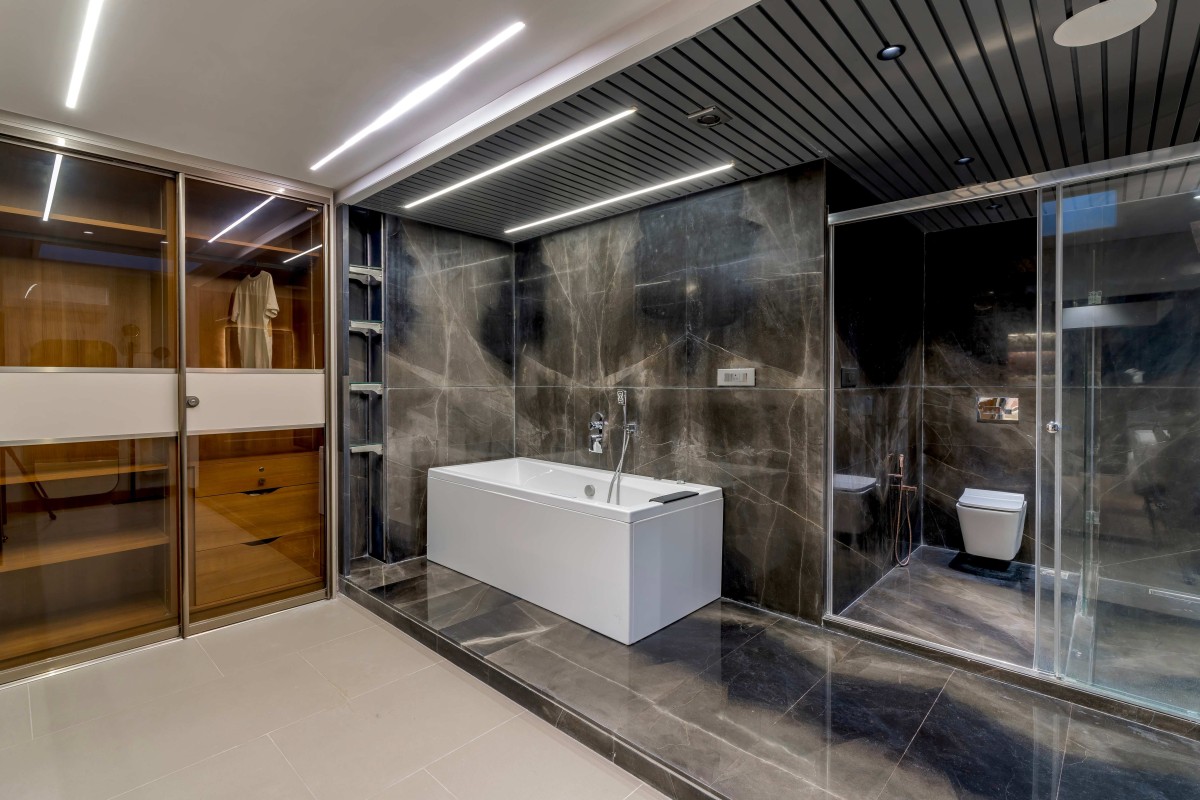 Bathroom at son's bedroom of DS House by Studionine Architects