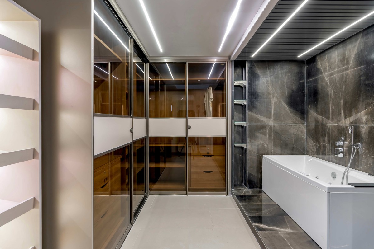 Bathroom at son's bedroom of DS House by Studionine Architects