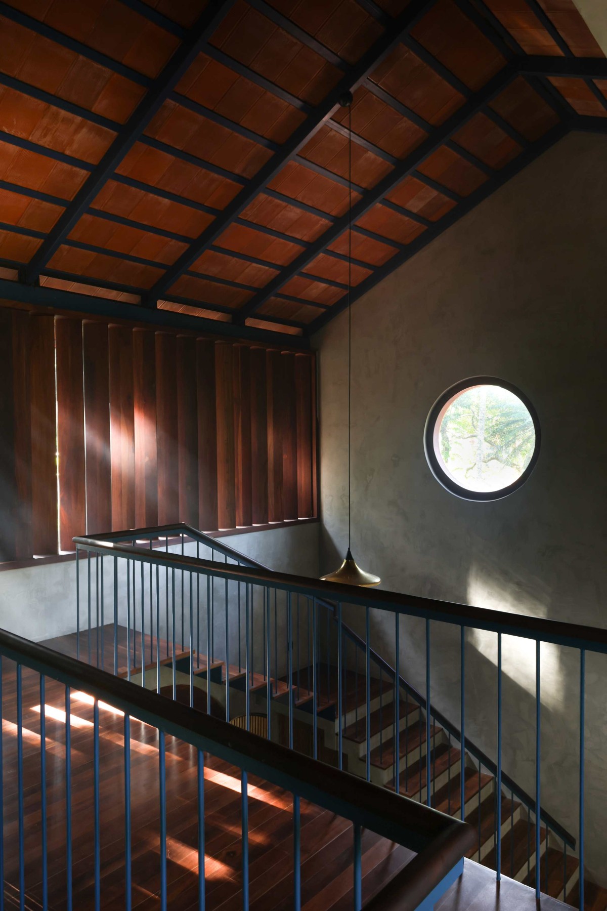 Bridge to staircase of Wabi Sabi House by Aslam Sham Architects