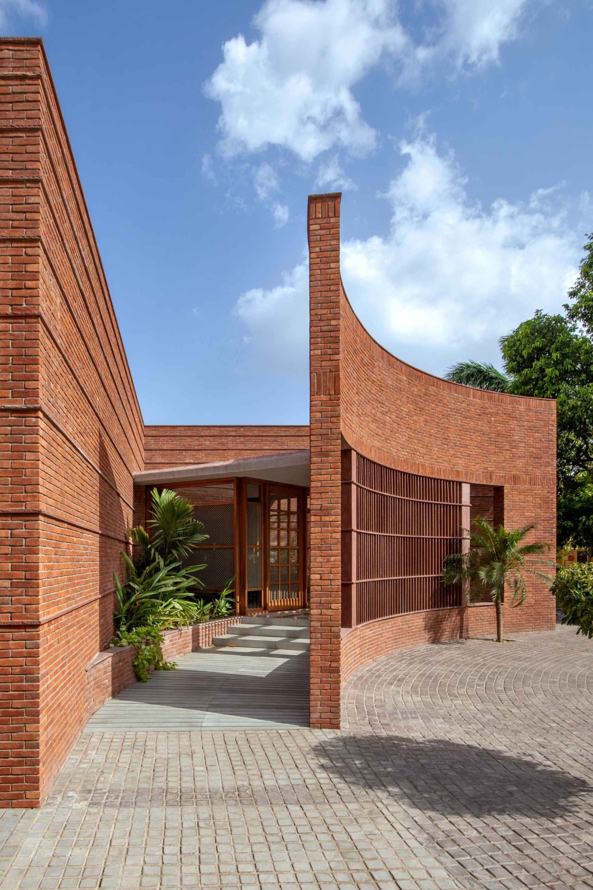 Exterior view of Sitish Parikh Farmhouse by Dipen Gada and Associates