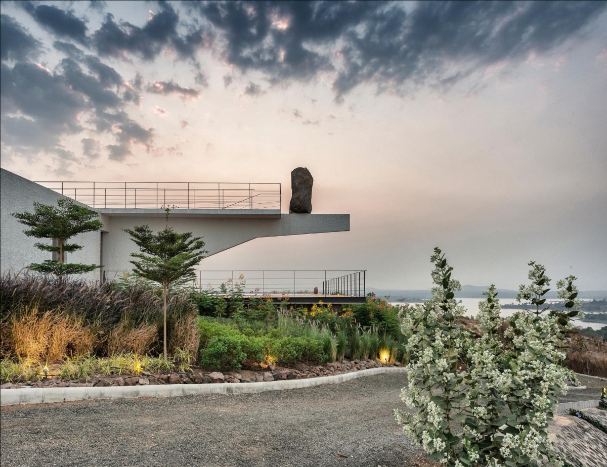 Exterior view of House with the Soaring Rock by SPASM Design Architects