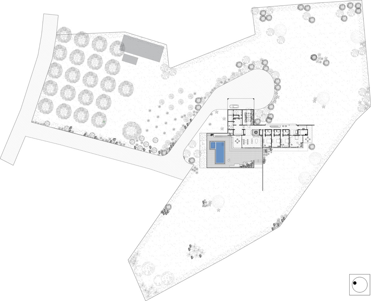 Site Plan of House with the Soaring Rock by SPASM Design Architects