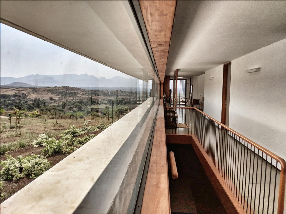 Upper floor of House with the Soaring Rock by SPASM Design Architects