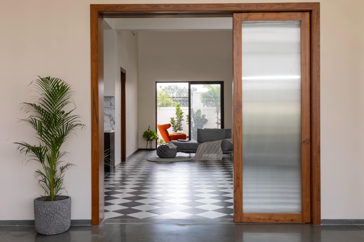 Passage to living area of The House of Frames by KalaaZodh Architecture