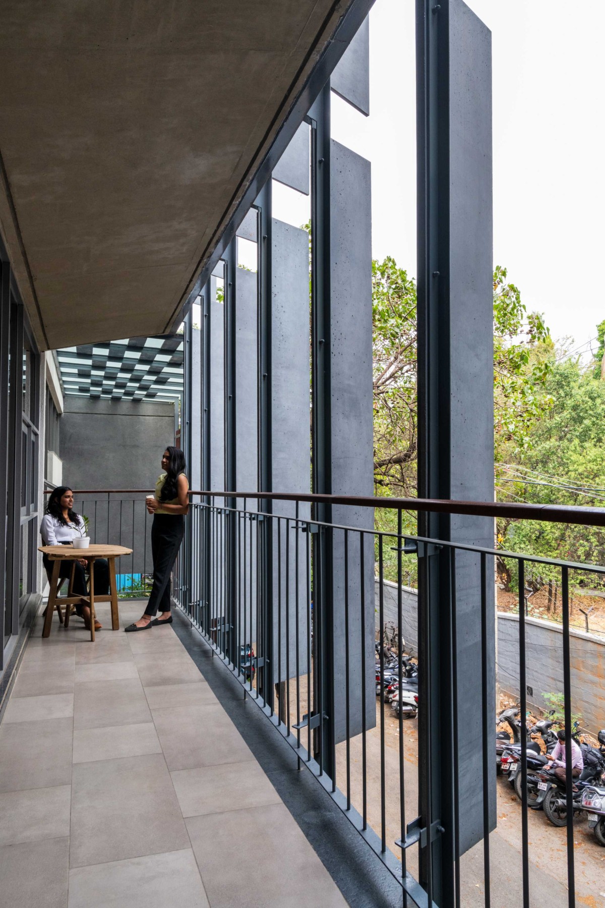 Visual connectivity achieved by staggered double-height balconies of Slate house by Funktion design