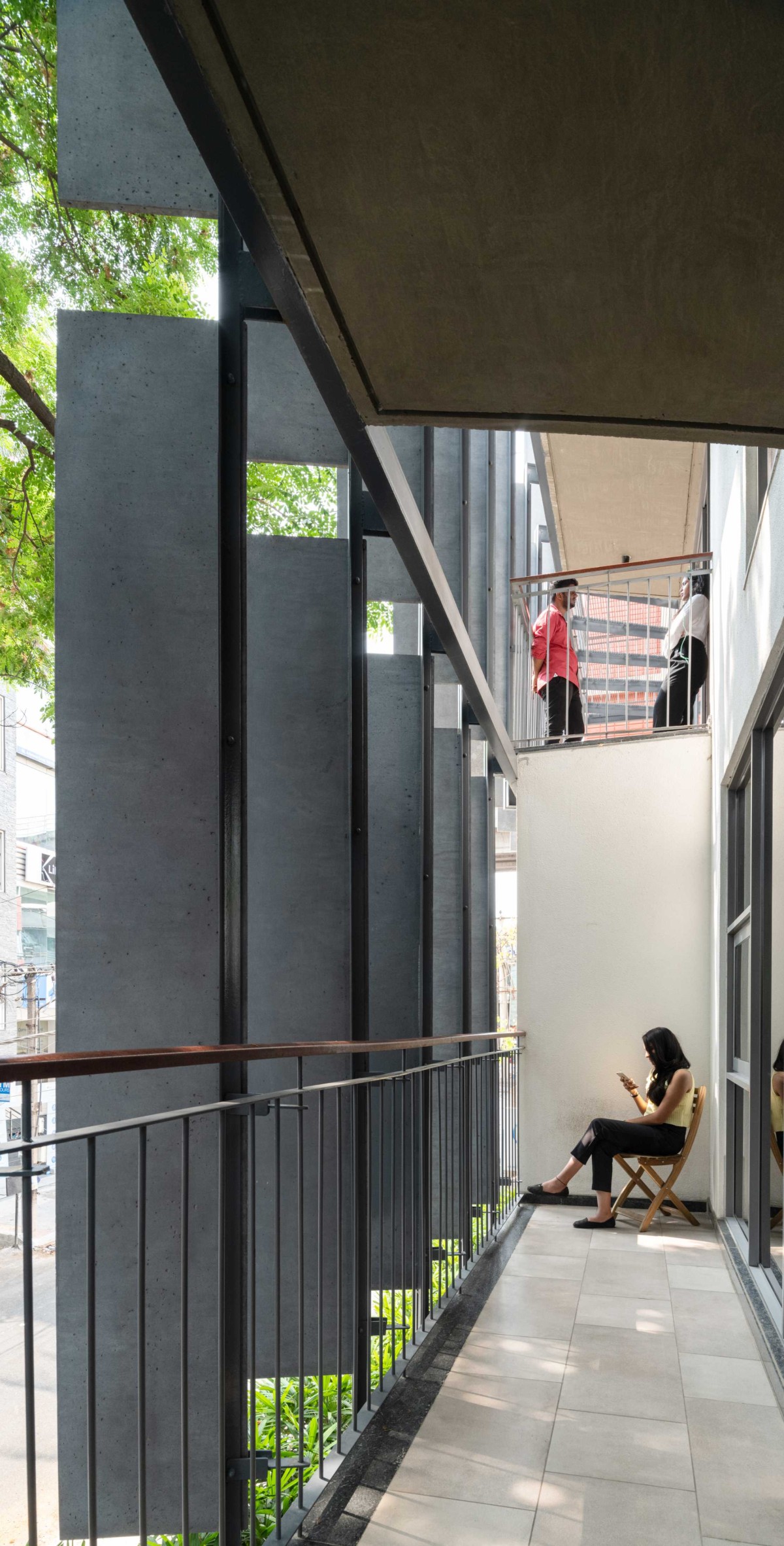 Visual connectivity achieved by staggered double-height balconies of Slate house by Funktion design