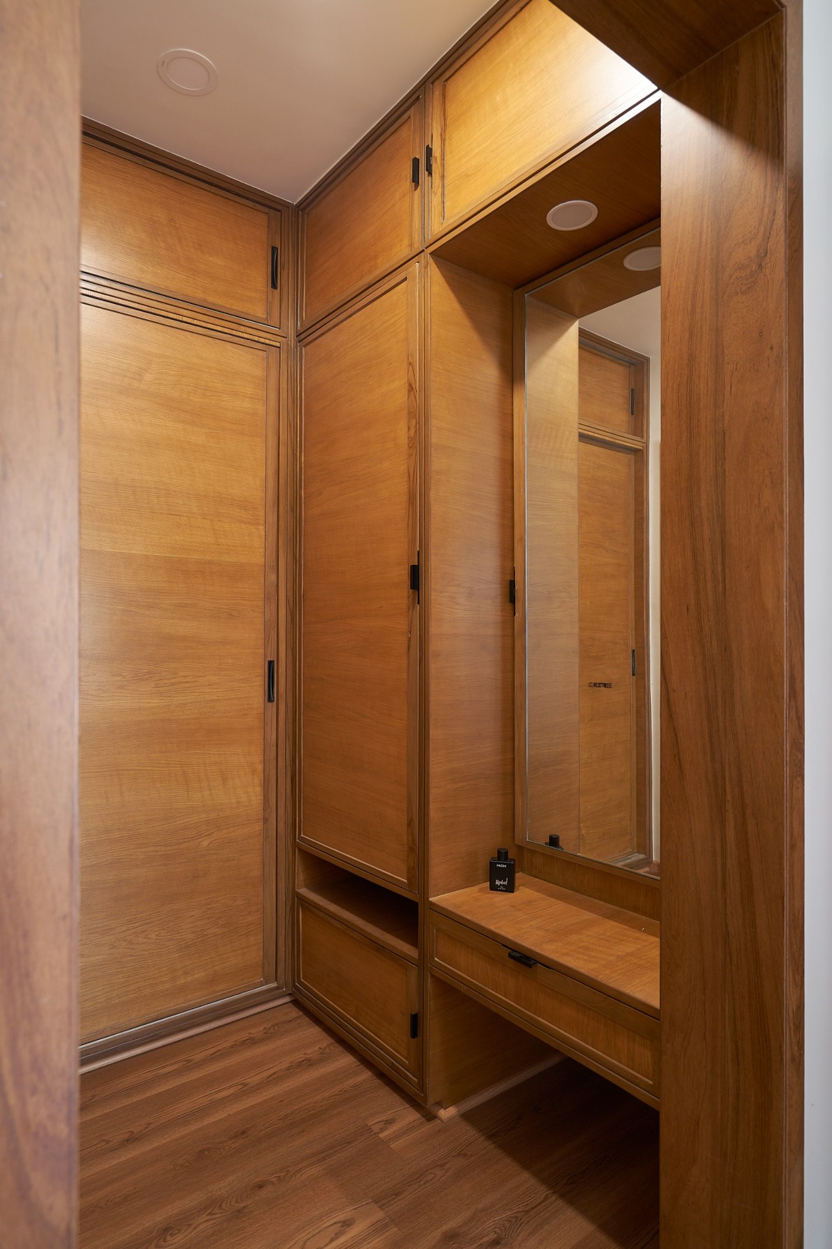 Walk in wardrobe at parents bedroom of Ganga 151 by Studio Habitect