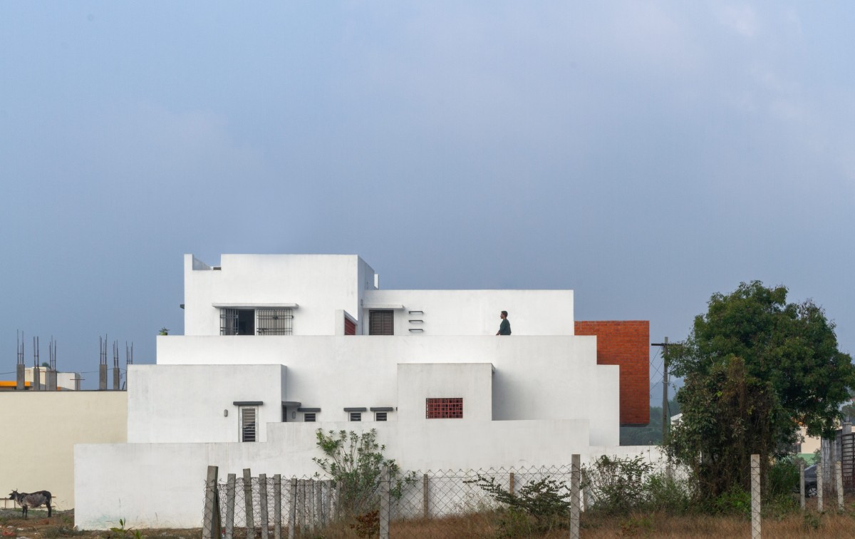 House with the existing neem tree on the north side