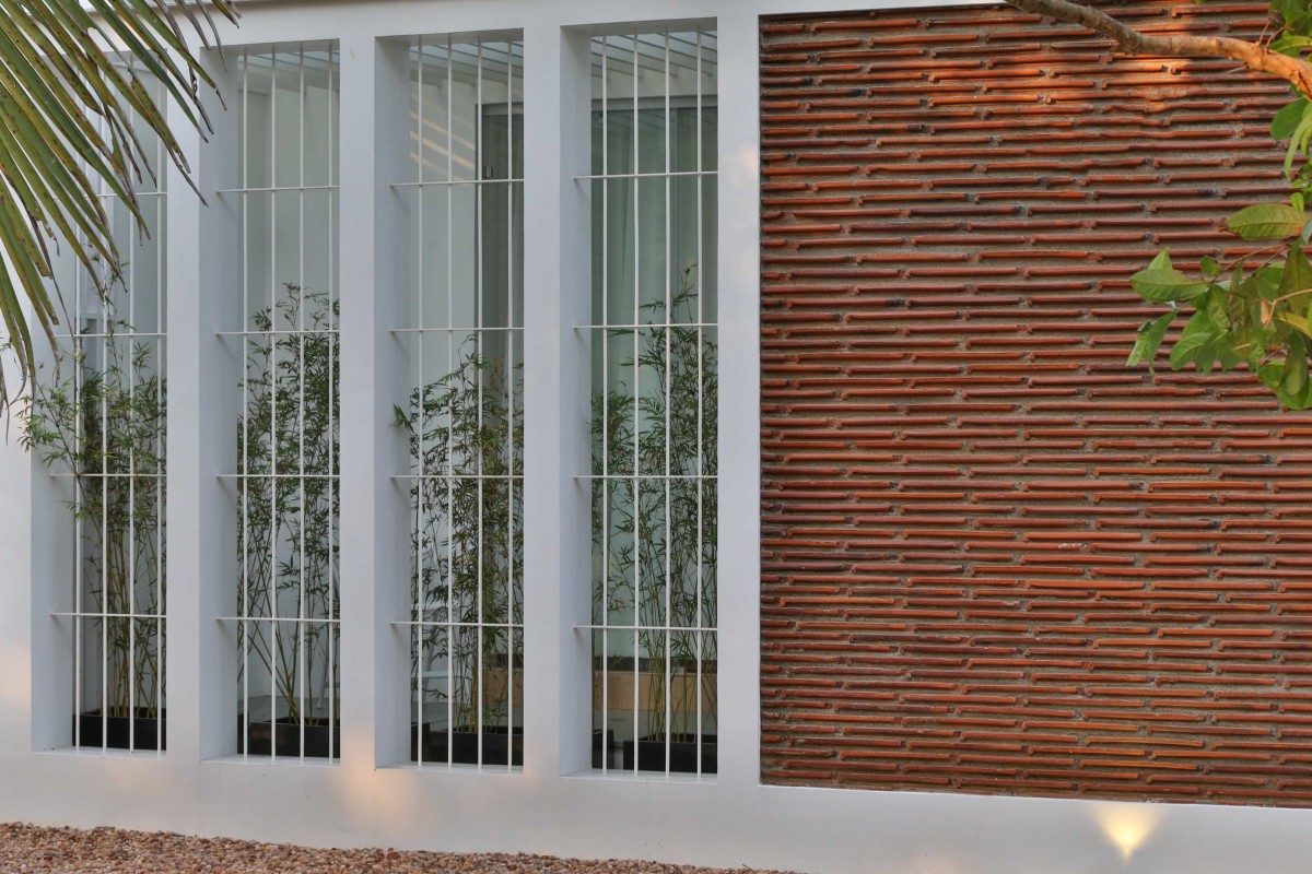 Detailed shot of window and wall of House of Volumes by PRAJC Design Consultants LLP