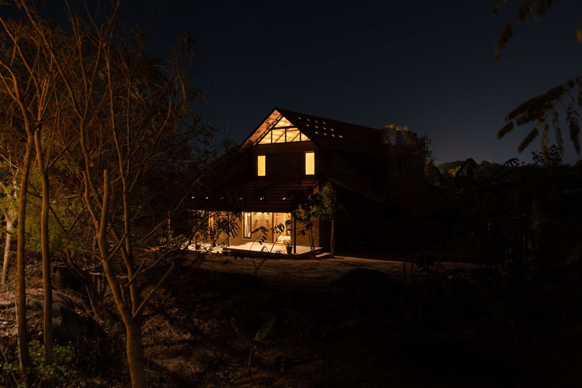 Night view of Boulder House by HabitArt Architecture Studio