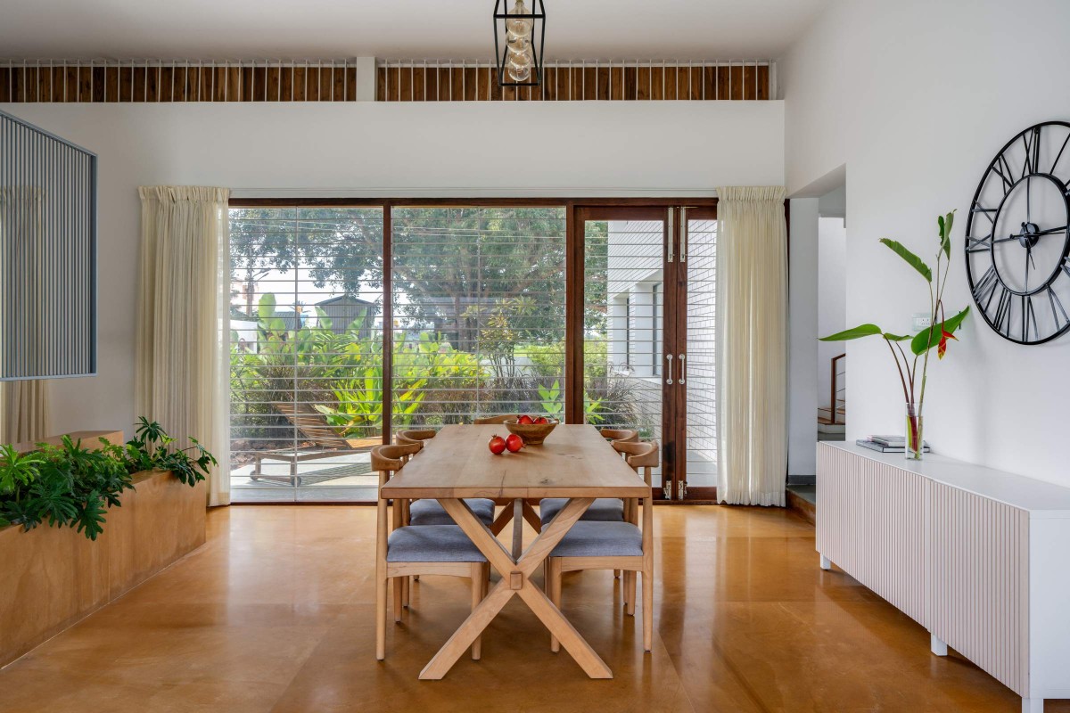 Dining room of The Modern Pastoral House by Sudaiva Studio