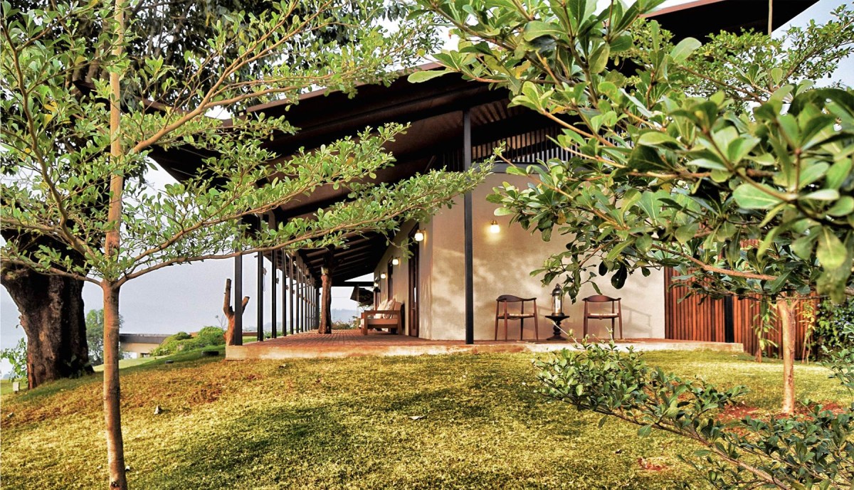 Exterior view of The House with the Gabion by SPASM Design Architects