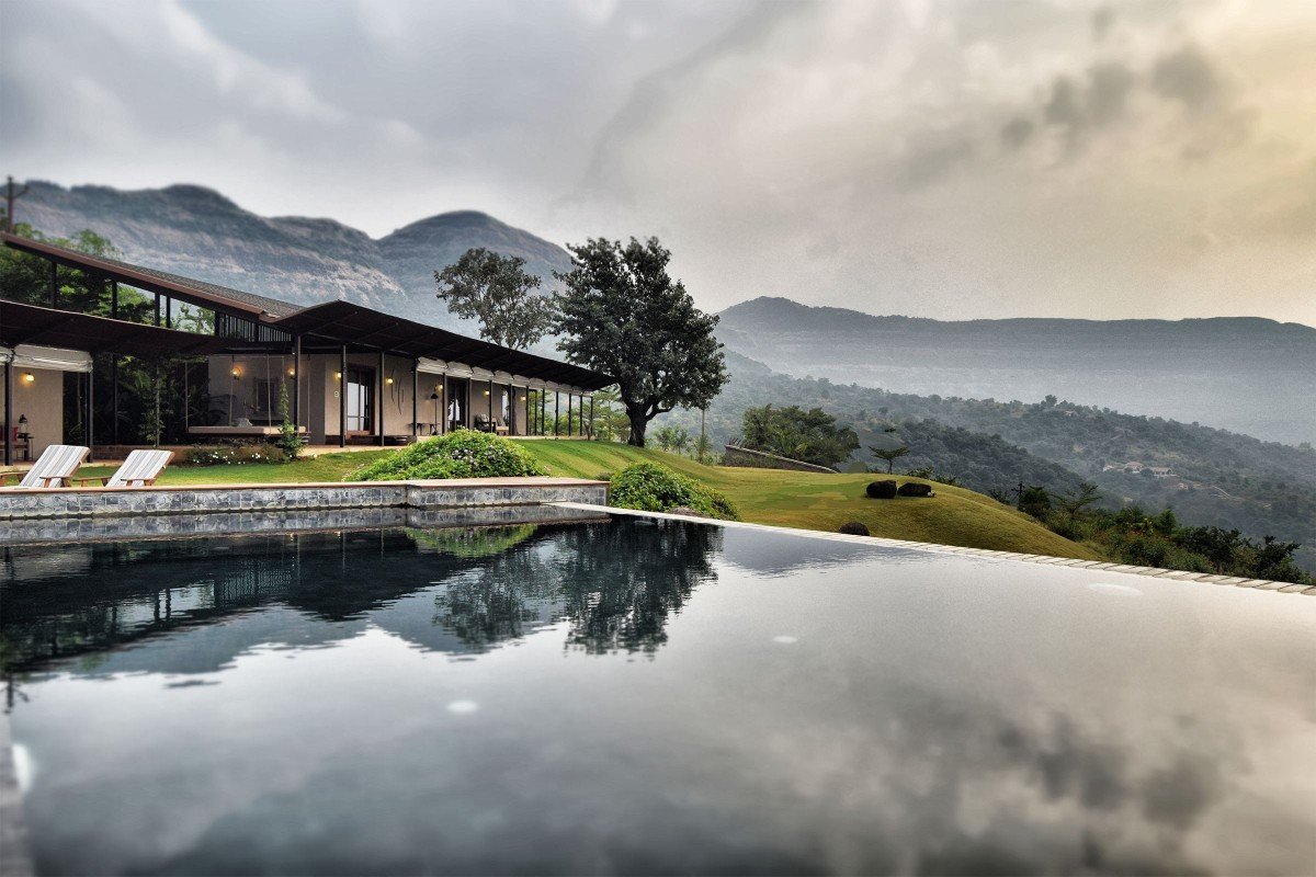 Pool view of The House with the Gabion by SPASM Design Architects