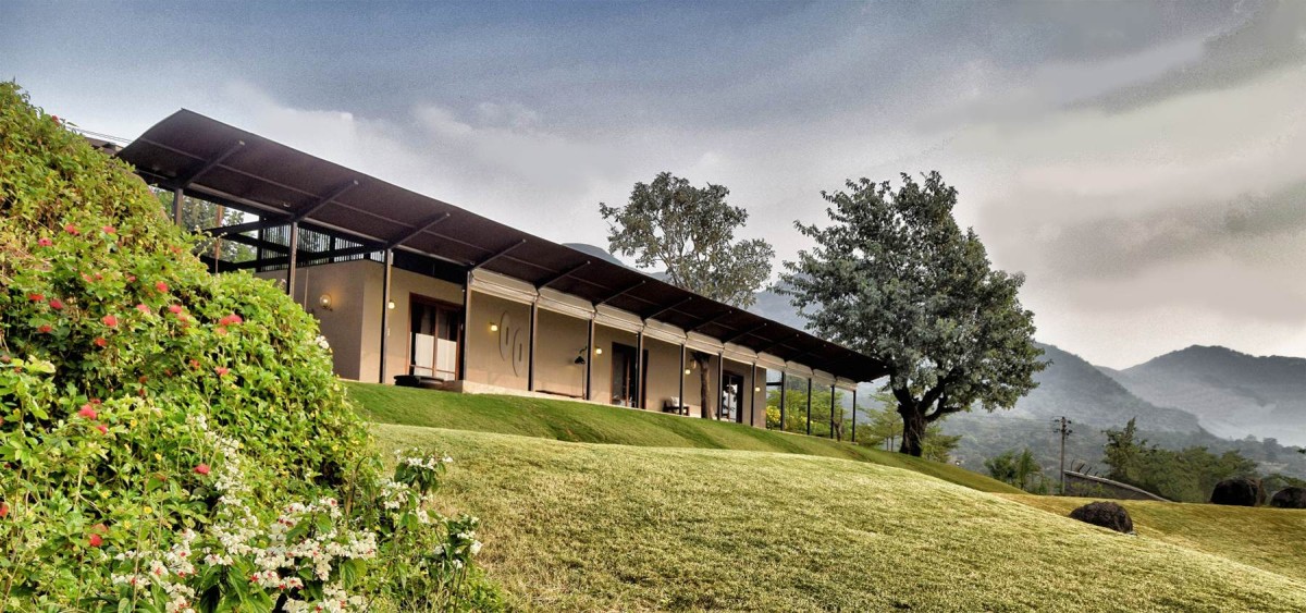 Exterior view of The House with the Gabion by SPASM Design Architects