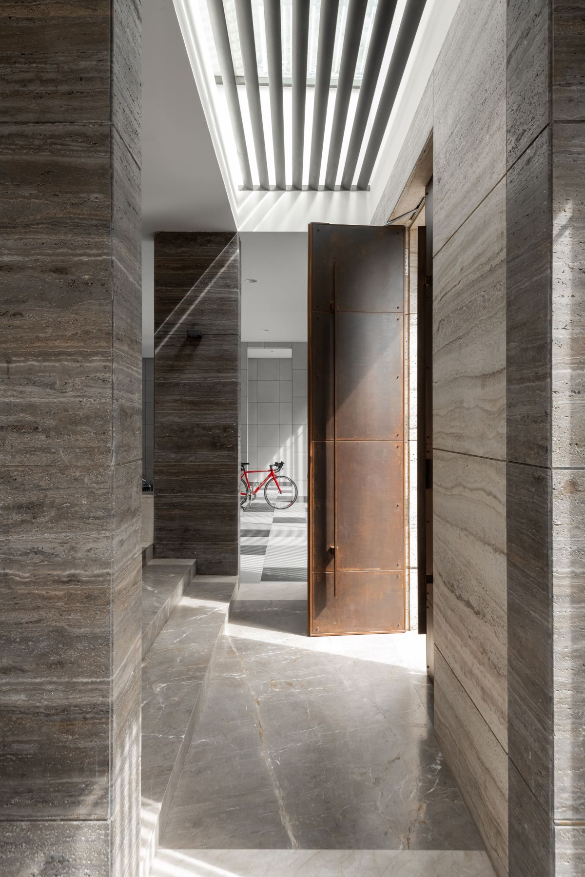 Corridor with vertical skylight of Veera Villa by Keystone Studio