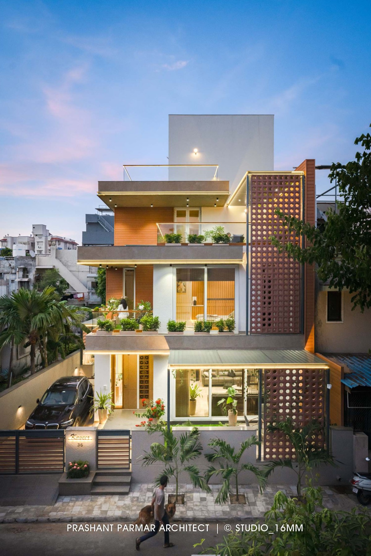 Dusk light exterior view of Terracotta Screen House by Prashant Parmar Architect  Shayona Consultant