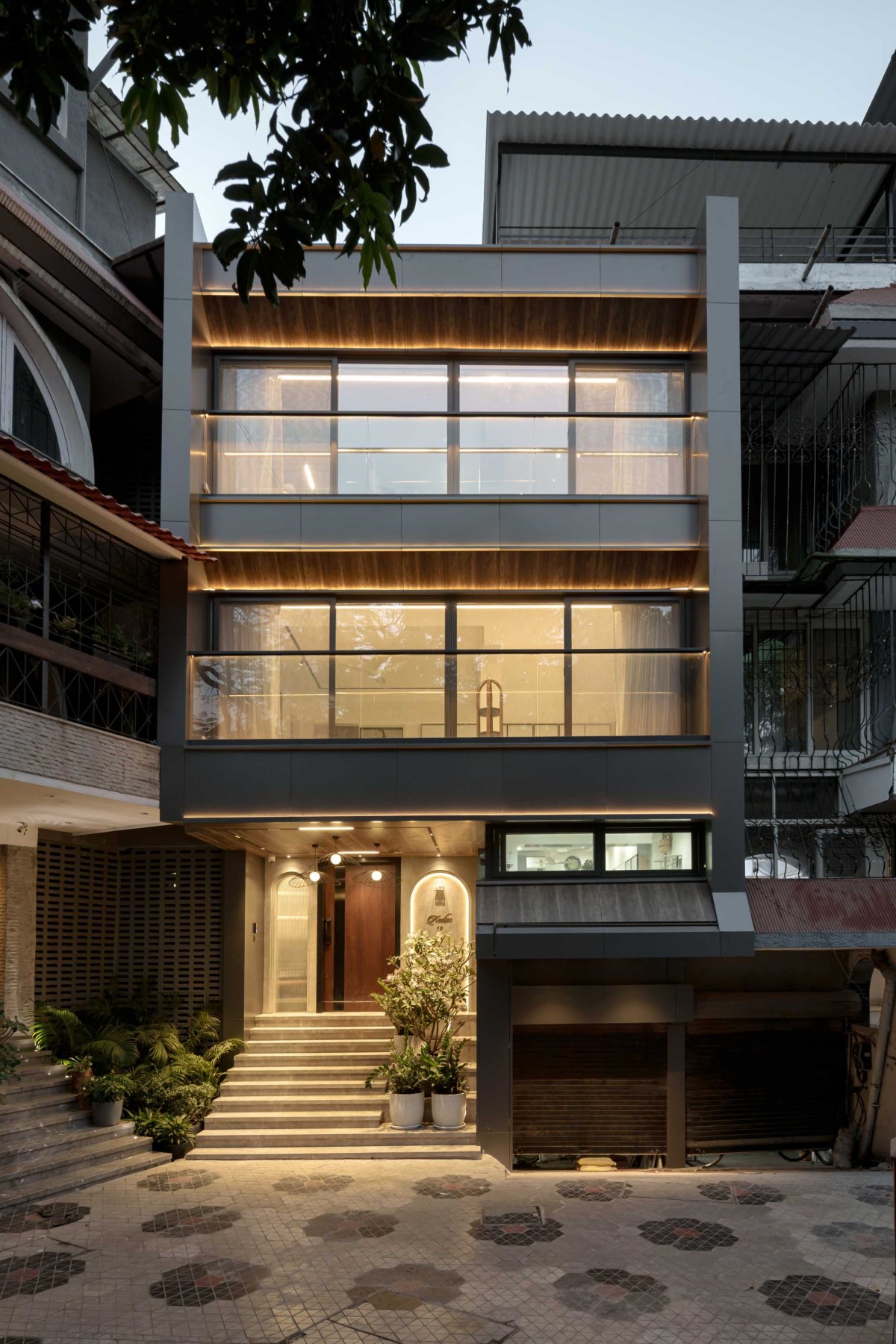 Dusk light exterior view of Kedia Bungalow by Plus V Architects