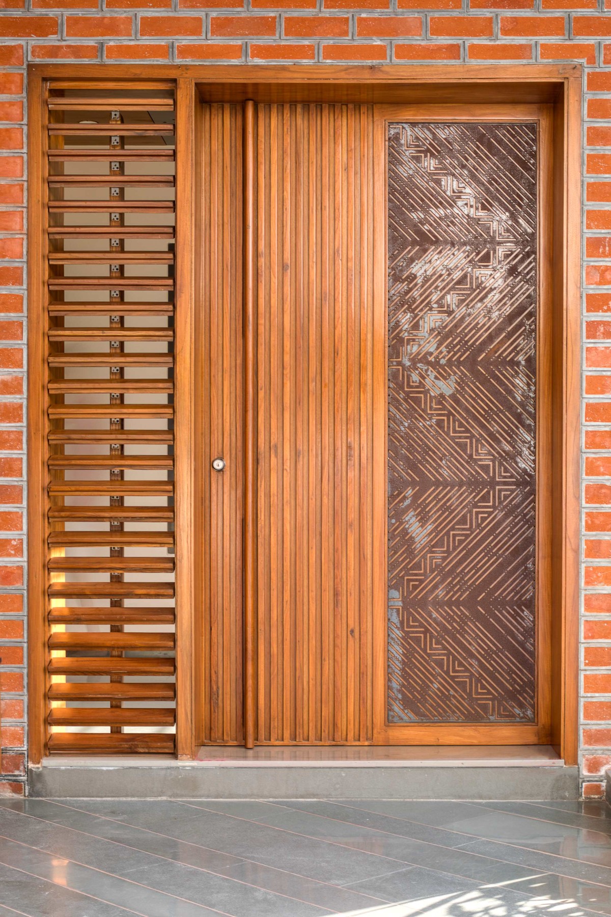 Detailed shot of door of Brick Screen House by MS Design Studio